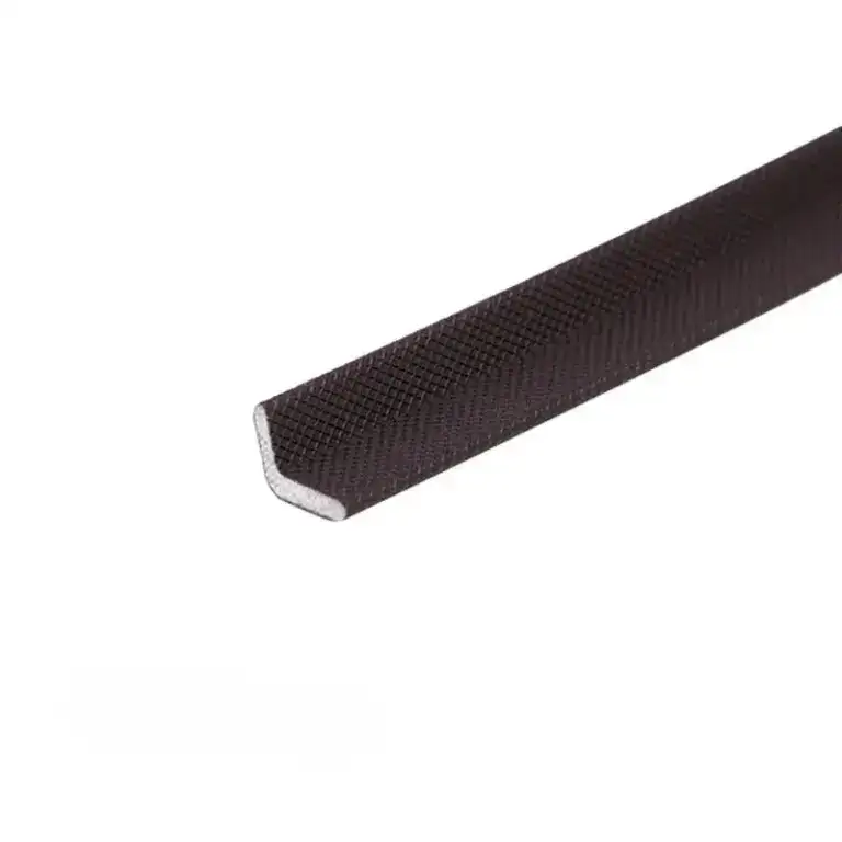 Close-up of a black rubber edge protector used for packaging and safeguarding edges during shipping and handling.