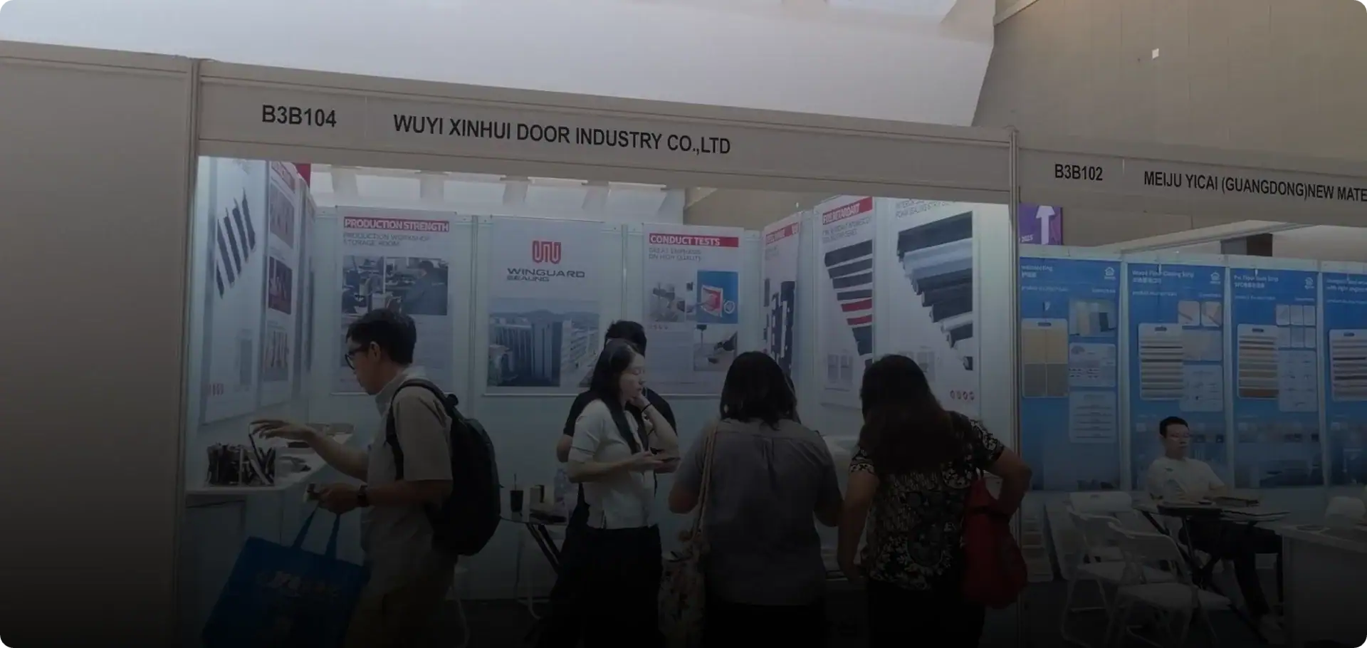 Trade show booth showcasing door industry products at a professional exhibition.