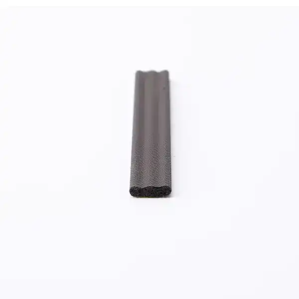 Close-up of a firearm silencer or gun suppressor, showcasing its textured metal surface and cylindrical shape, used for reducing noise during shooting.