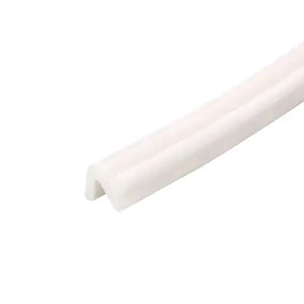 Close-up of a white plastic edge protector used for safety and protection of furniture or surfaces.