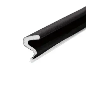 Close-up of a black flexible door seal with foam core for insulation and weatherproofing.