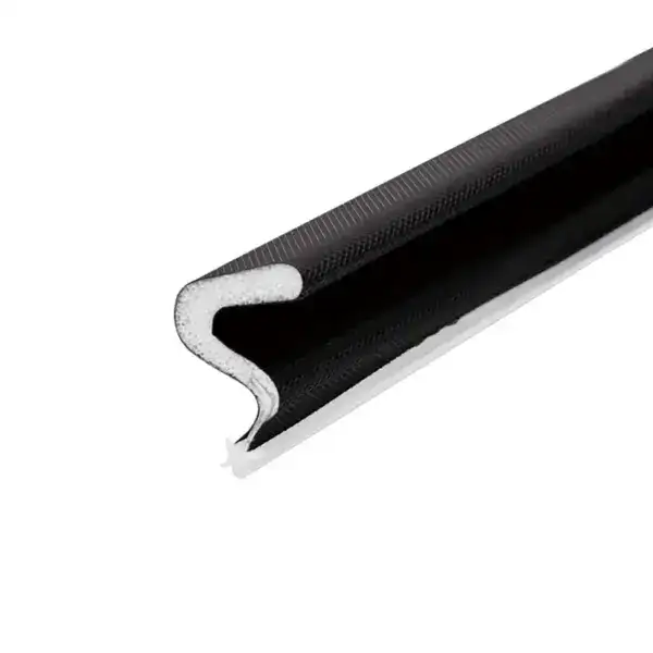 Close-up of a black flexible door seal with foam core for insulation and weatherproofing.