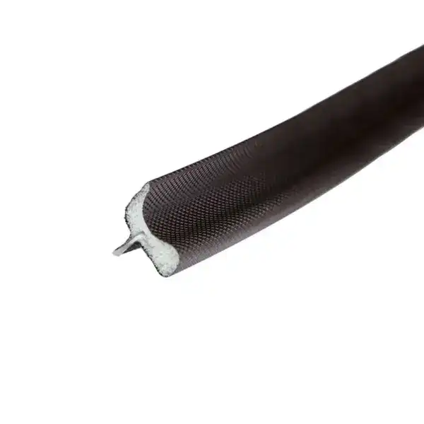 Close-up of a black flexible sealing gasket with a textured surface, used for sealing applications in industrial environments.