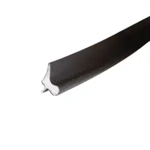 Close-up of a black sealing strip with textured surface and a white foam core, used for sealing applications in industrial settings.