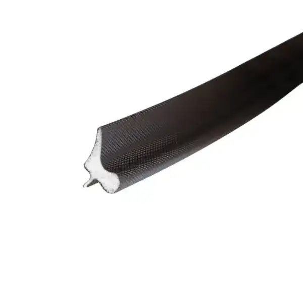 Close-up of a black sealing strip with textured surface and a white foam core, used for sealing applications in industrial settings.