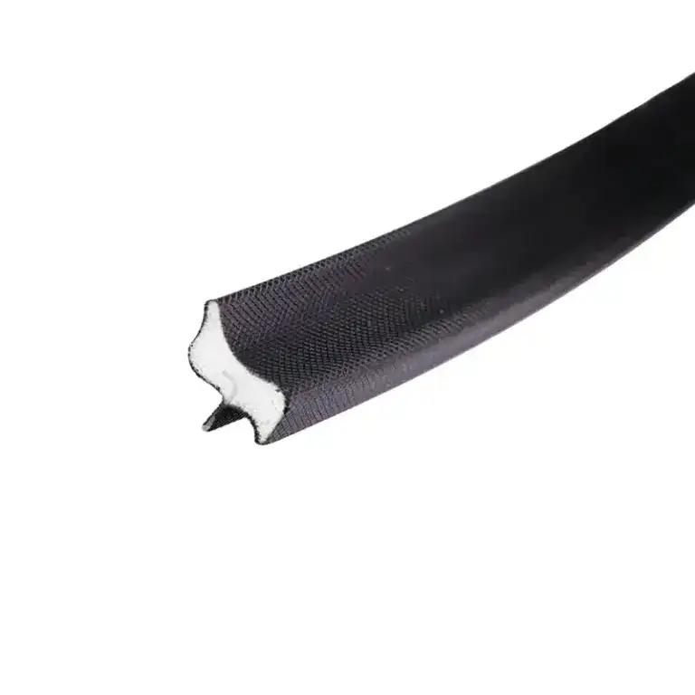 Close-up of a black sealing strip with a white interior, designed for sealing applications in industrial settings.