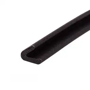 Close-up of a black rubber sealing strip with a U-shaped profile, used for sealing gaps and providing insulation in construction or automotive applications.