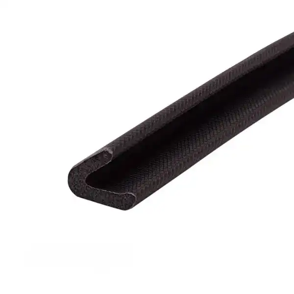 Close-up of a black rubber sealing strip with a U-shaped profile, used for sealing gaps and providing insulation in construction or automotive applications.
