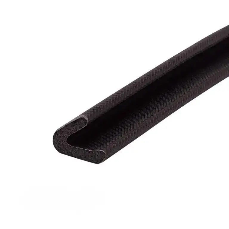Close-up of a black rubber sealing strip with a U-shaped profile, used for sealing gaps and providing insulation in construction or automotive applications.