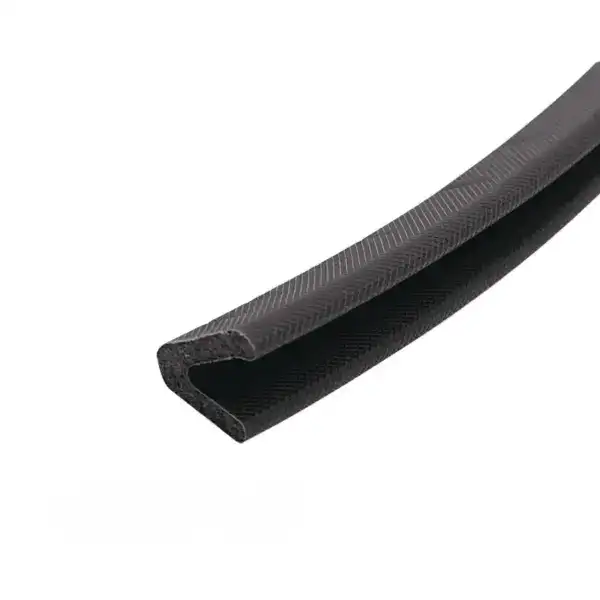 Close-up of black rubber edge trim, used for sealing and finishing edges in automotive and industrial applications.