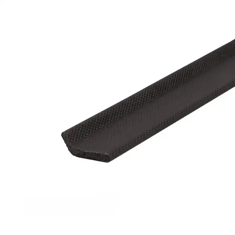 Close-up of a black rubber edge protector with textured surface for safety and durability.
