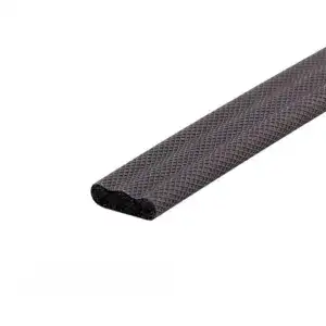 Close-up of black rubber edge strip with textured surface, used for safety and protection in industrial or construction settings.