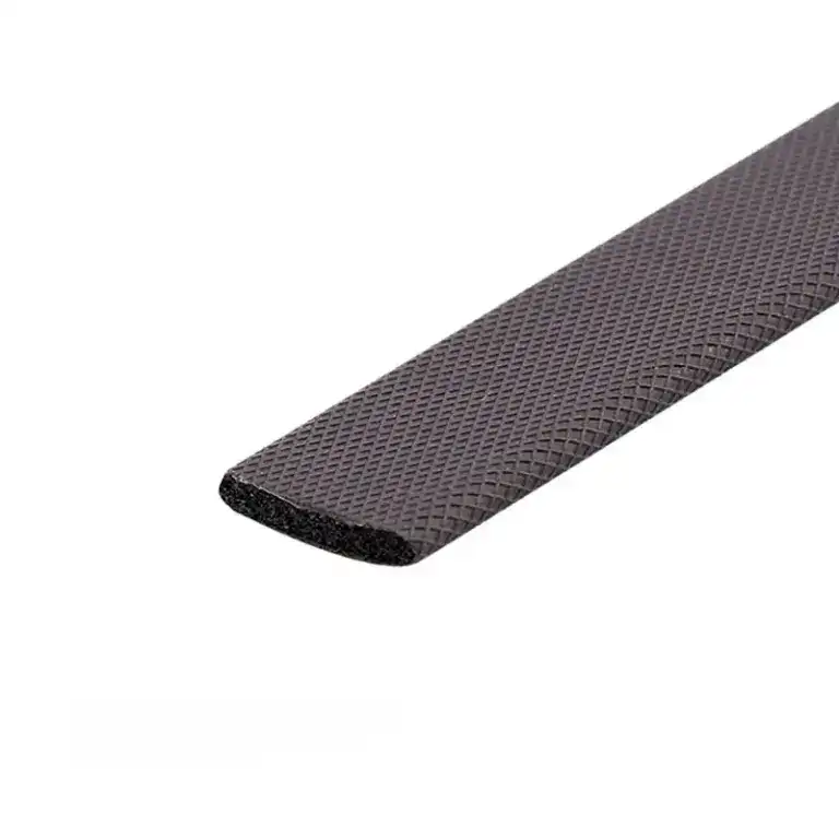 Close-up of a black rubber edge with textured surface, designed for safety and grip in industrial or construction applications.