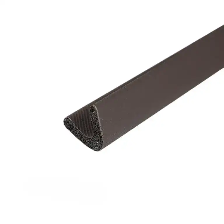 Close-up of black U-channel edge trim used for flooring or wall finishing, made of durable material with a textured surface.