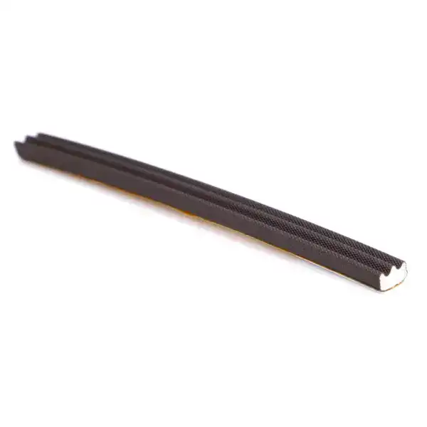 Close-up of a black weatherproofing door seal strip for insulation and sealing gaps in doors and windows.