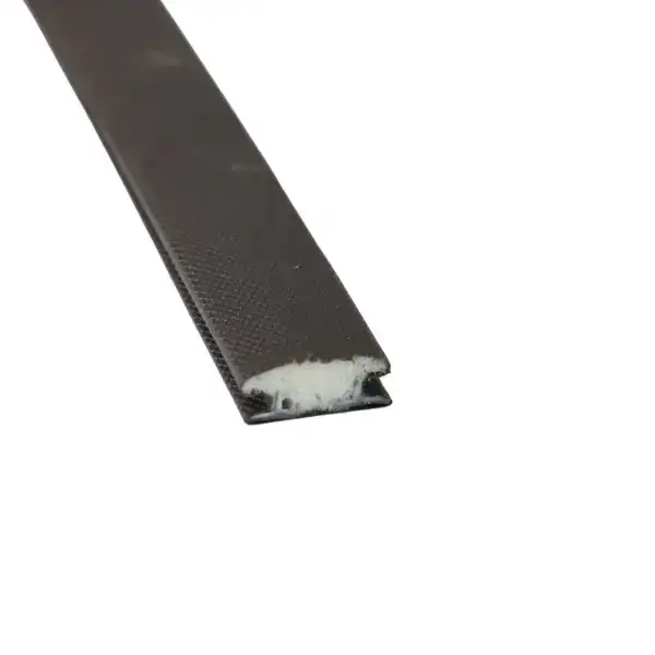 Close-up of a black magnetic strip used in security cards and access control systems. The strip features a textured surface with a white magnetic layer at the edge, designed for data storage and authe.