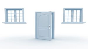 Light blue door with two large windows on either side, set in a white background, showcasing a clean and modern design.